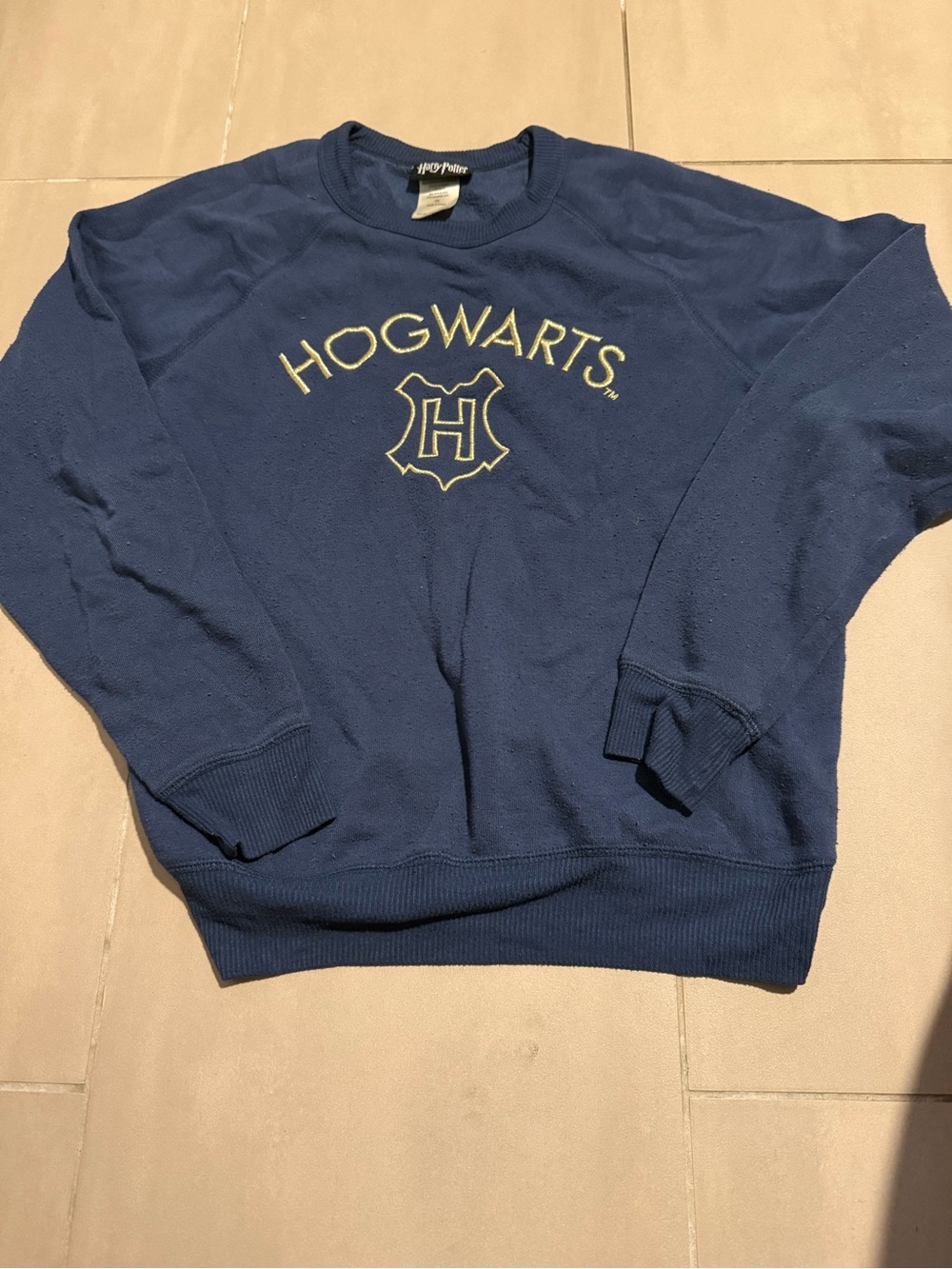 Warner Bros. Hogwarts Crewneck Sweater in Navy with Gold Embroidery